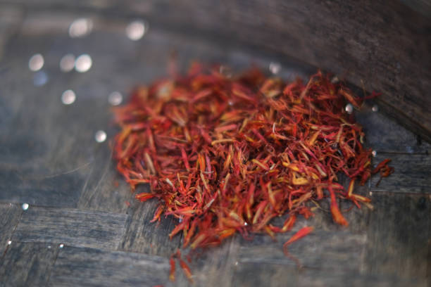 Close-up shot of a red saffron in dark wicker tray
